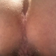A short rear-view close-up of Nazzy over the toilet as she pushes out a firm turd into the bowl. Presented in 720P vertical HD format. About half a minute.